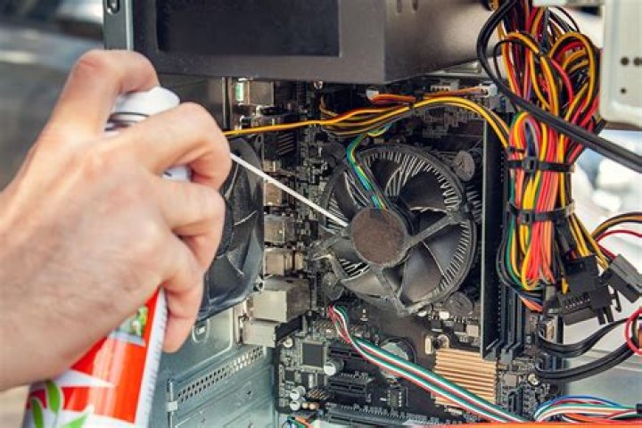 How do I clean my computer with compressed air?