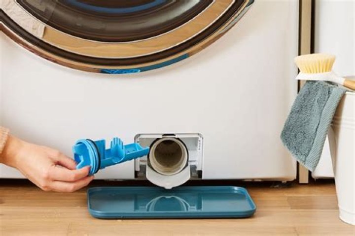 How do you drain a front load washer for moving?