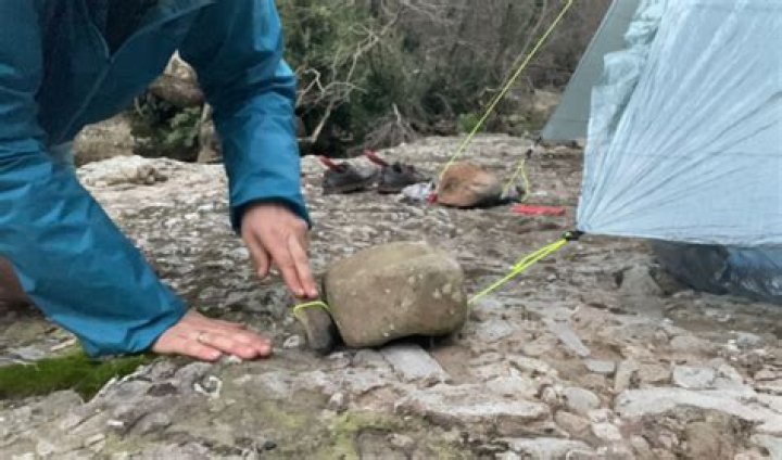 How do you secure a tent on rock?