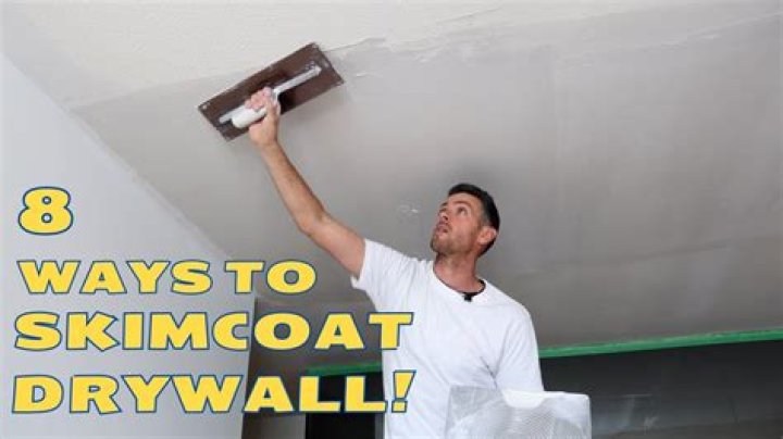 How do you skim coat a wall with drywall mud?