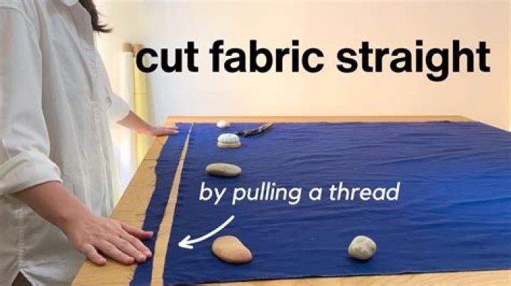 How do you straighten fabric before cutting?