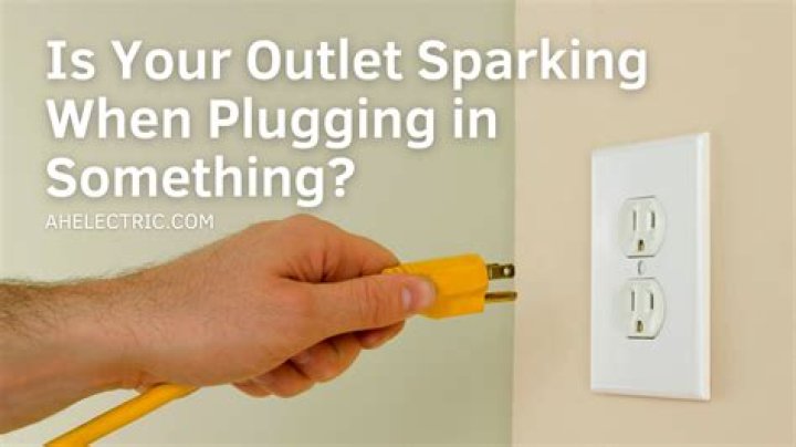 What causes outlet to spark when plugging in?