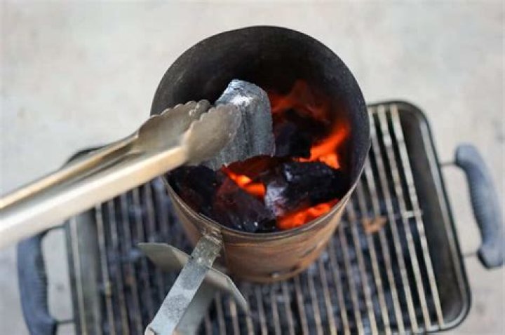 What is the best way to start a charcoal fire?